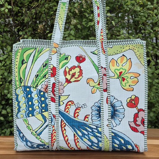 white vibrant bird print quilted cotton tote bag reversible machine washable with pockets lifestyle shot