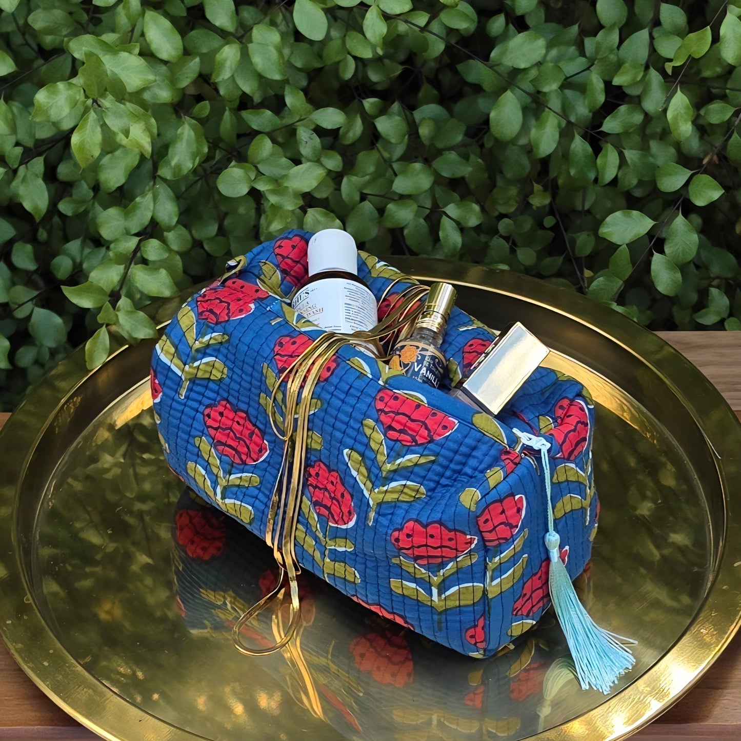 Red Tulips in Blue Make-up Bag