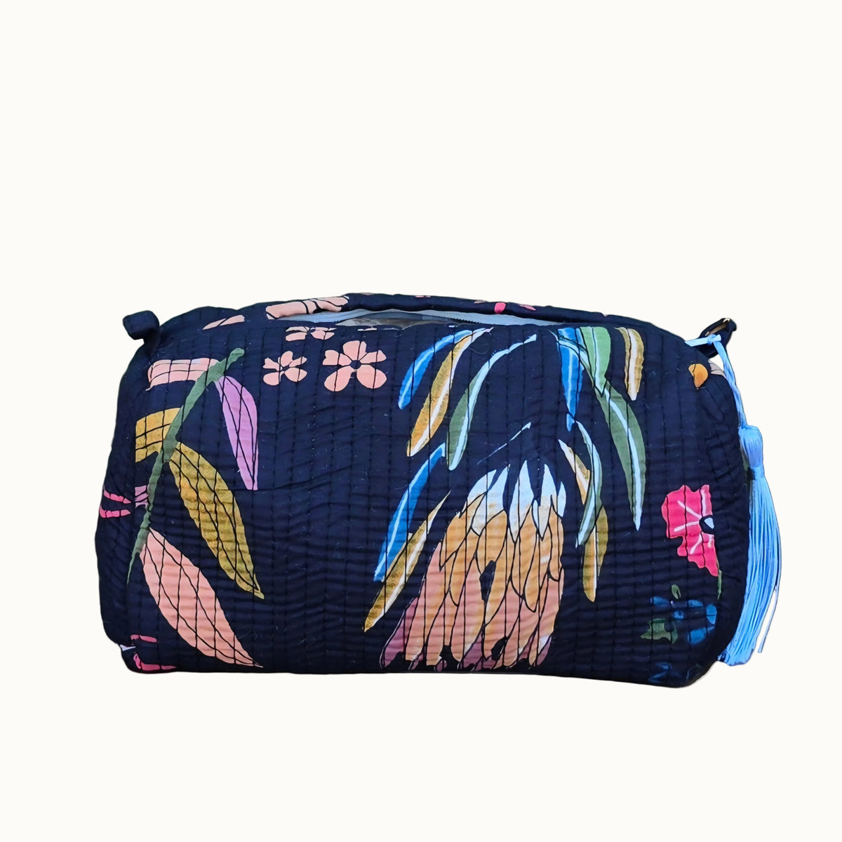 black abstract floral print makeup bag with tassles and waterproof lining and pockets