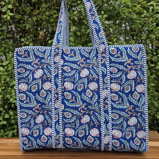 blooming blue pomegranates quilted cotton tote bag reversible machine washable with pockets lifestyle image