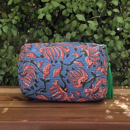 blue and coral pink floral print makeup bag with tassles and waterproof lining and pockets front image