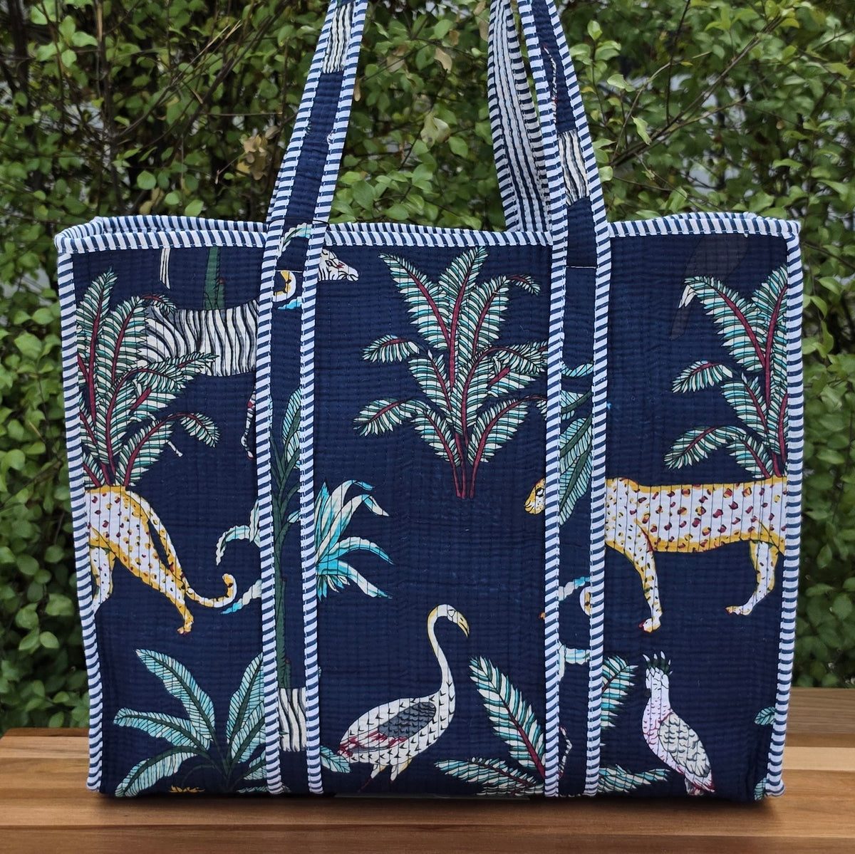 blue jungle print quilted cotton tote bag reversible machine washable with pockets lifestyle shot