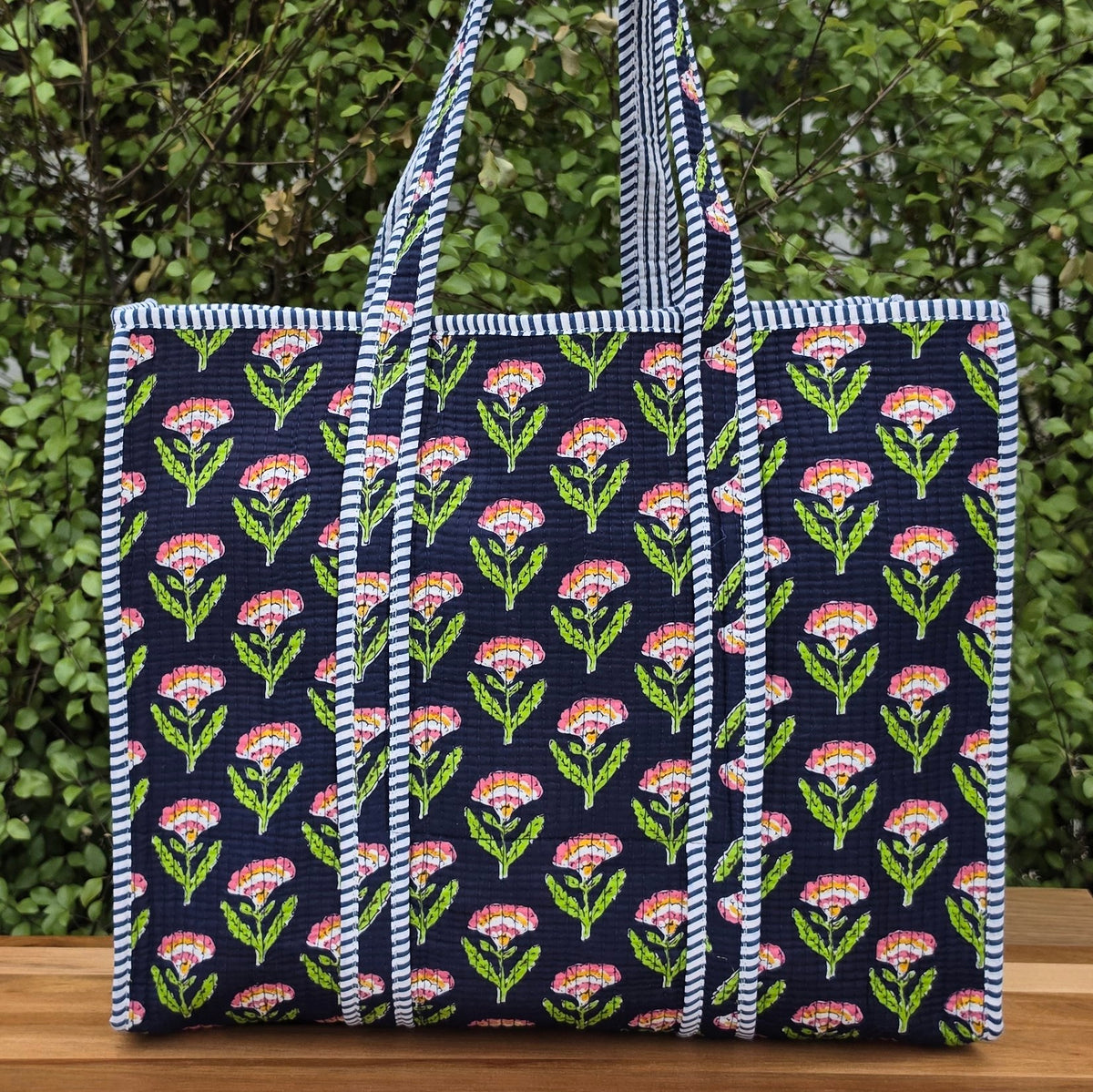 blue pink and orange floral print quilted cotton tote bag reversible machine washable with pockets lifestyle image