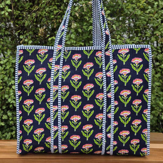 blue pink and orange floral print quilted cotton tote bag reversible machine washable with pockets lifestyle image