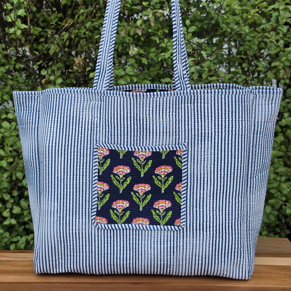 blue pink and orange floral print quilted cotton tote bag reversible machine washable with pockets lifestyle reverse image