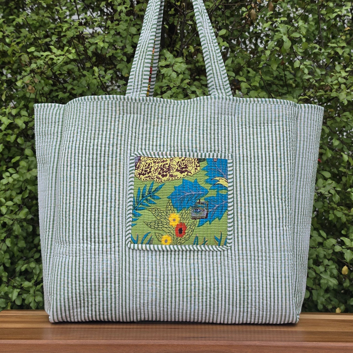 green freida kahlo jungle print quilted cotton tote bag reversible machine washable with pockets lifestyle reversible shot