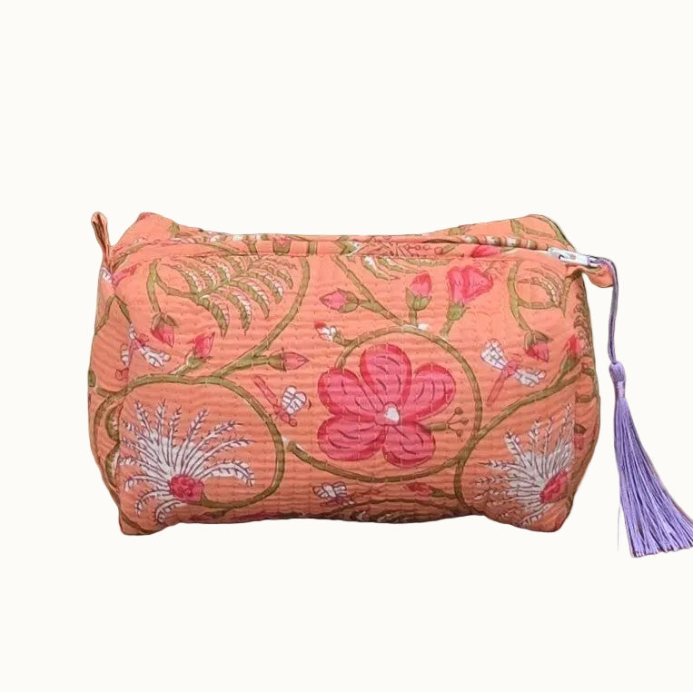 orange pastel floral makeup bag with tassles and waterproof lining and pockets