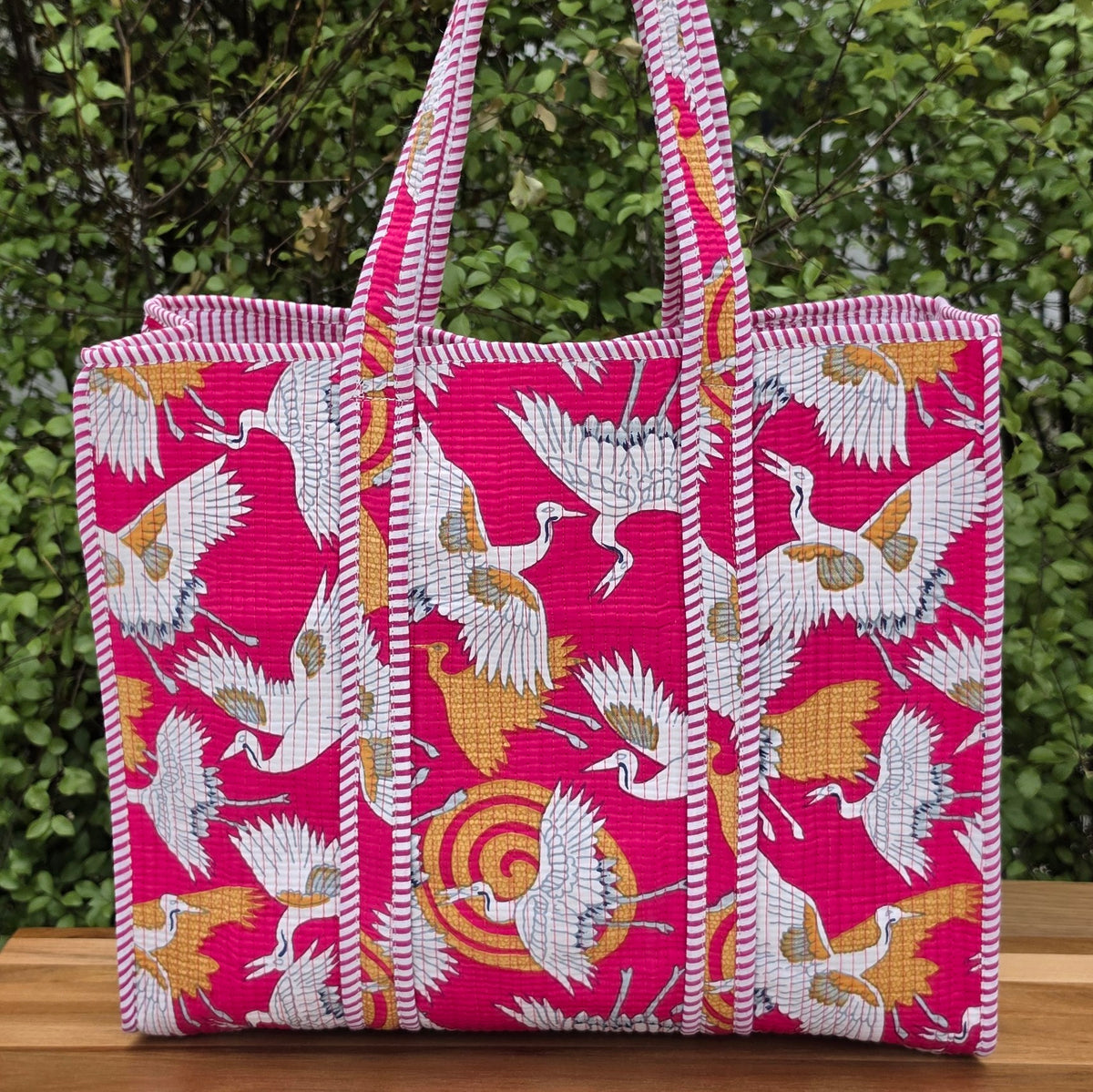 pink white cranes print quilted cotton tote bag reversible machine washable with pockets lifestyle image