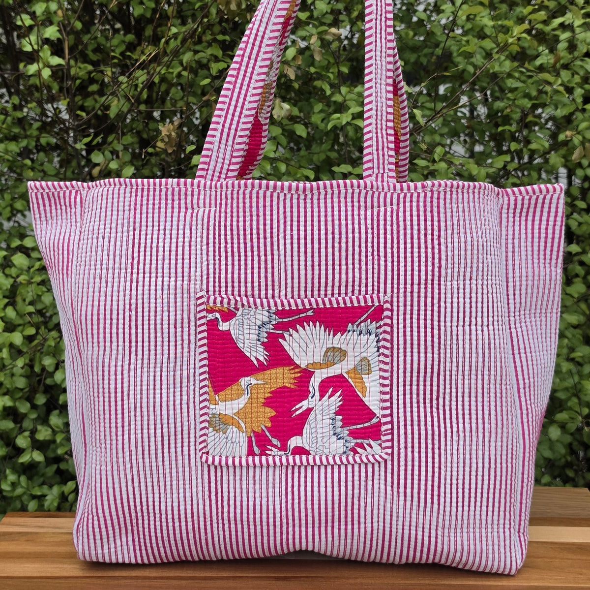 pink white cranes print quilted cotton tote bag reversible machine washable with pockets lifestyle reverse image