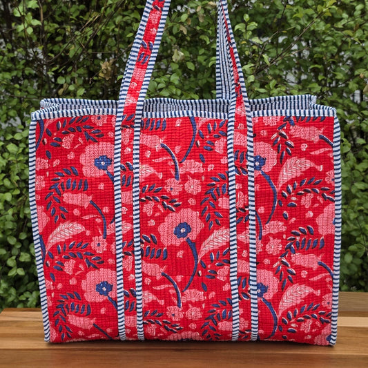 red and blue blockprint floral pattern quilted cotton tote bag reversible machine washable with pockets lifestyle image