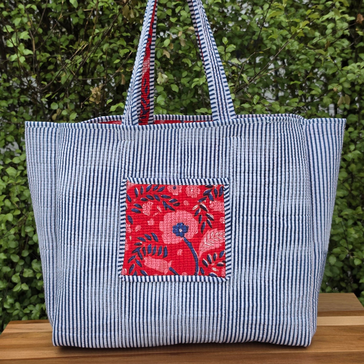 red and blue blockprint floral pattern quilted cotton tote bag reversible machine washable with pockets lifestyle reverse image