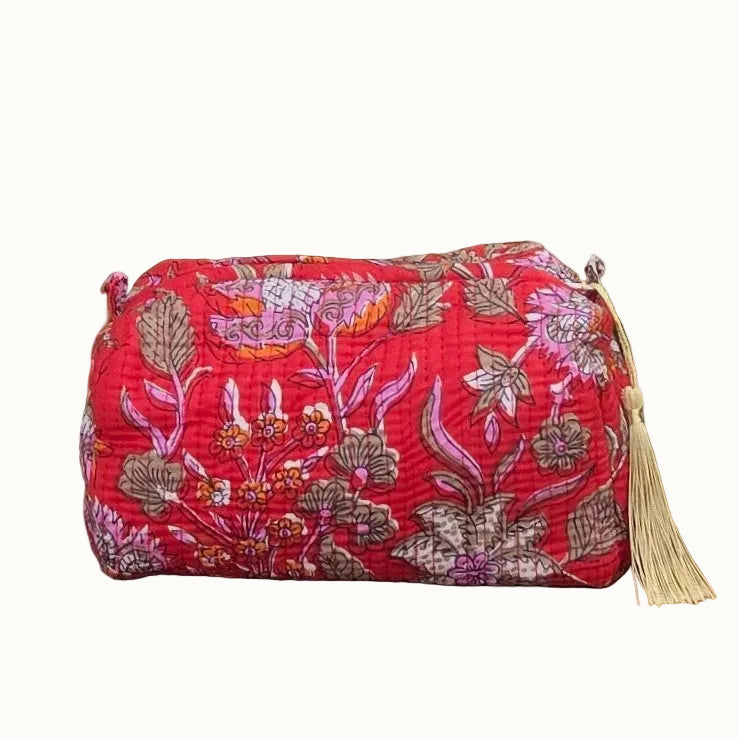 red floral print makeup bag with tassles and waterproof lining and pockets