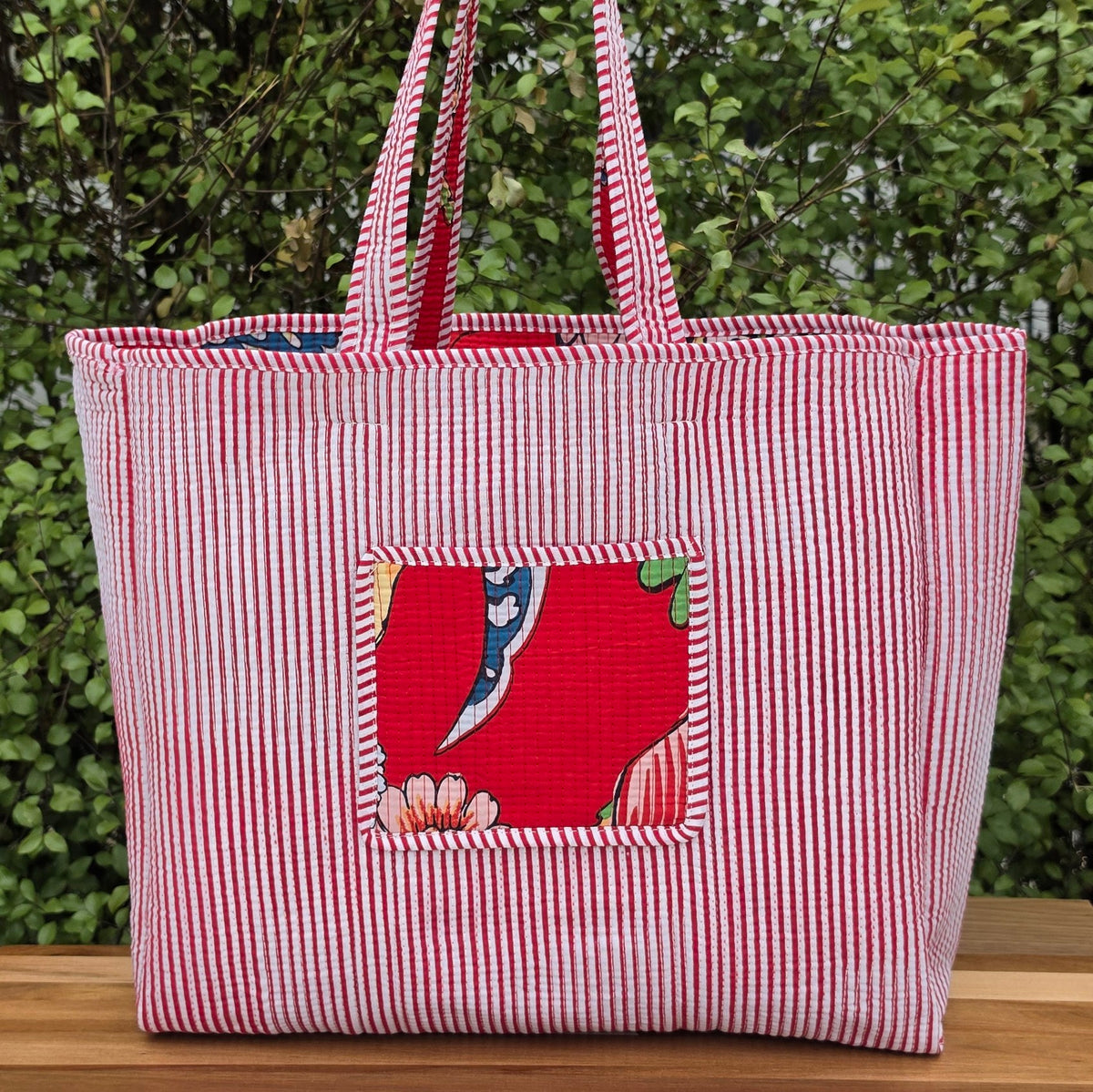 red vibrant bird print quilted cotton tote bag reversible machine washable with pockets lifestyle reverse shot