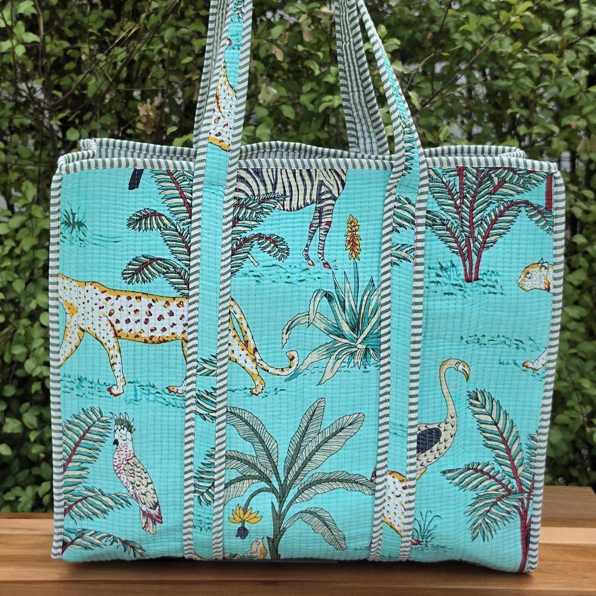 turqiose blue jungle print quilted cotton tote bag reversible machine washable with pockets lifestyle shot