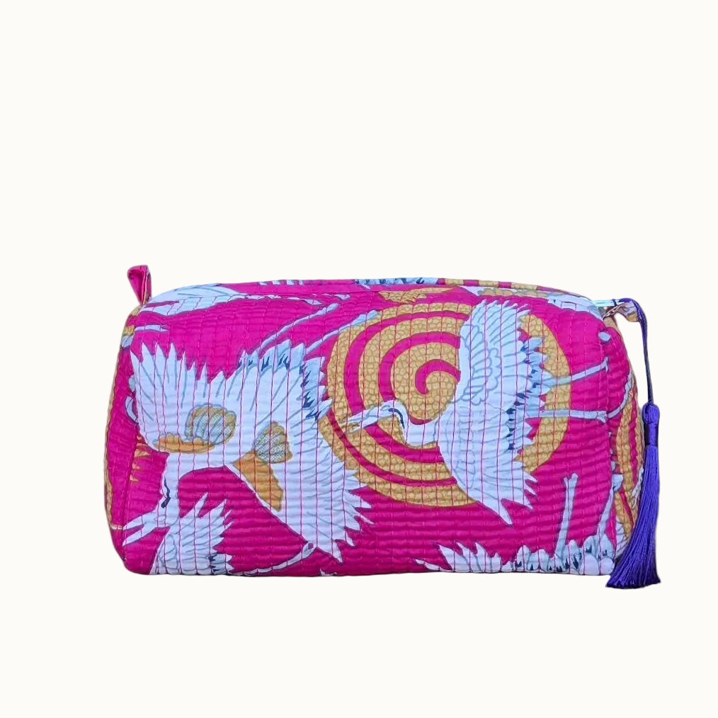 white cranes in pink makeup bag with tassles and waterproof lining and pockets