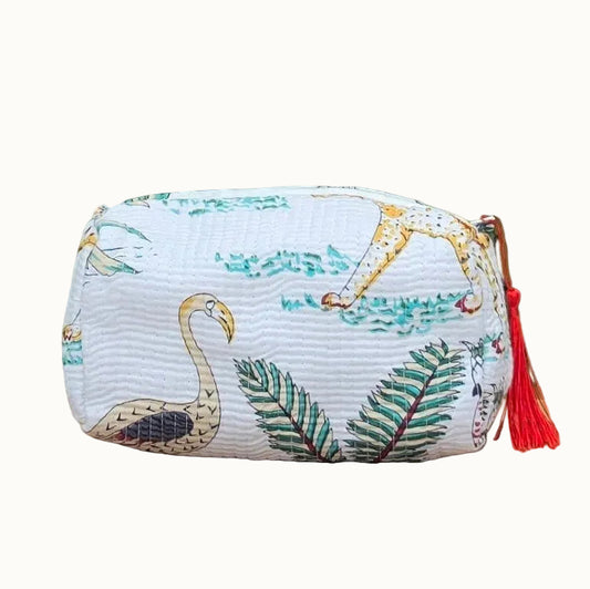 white jungle print makeup bag with tassles and waterproof lining and pockets