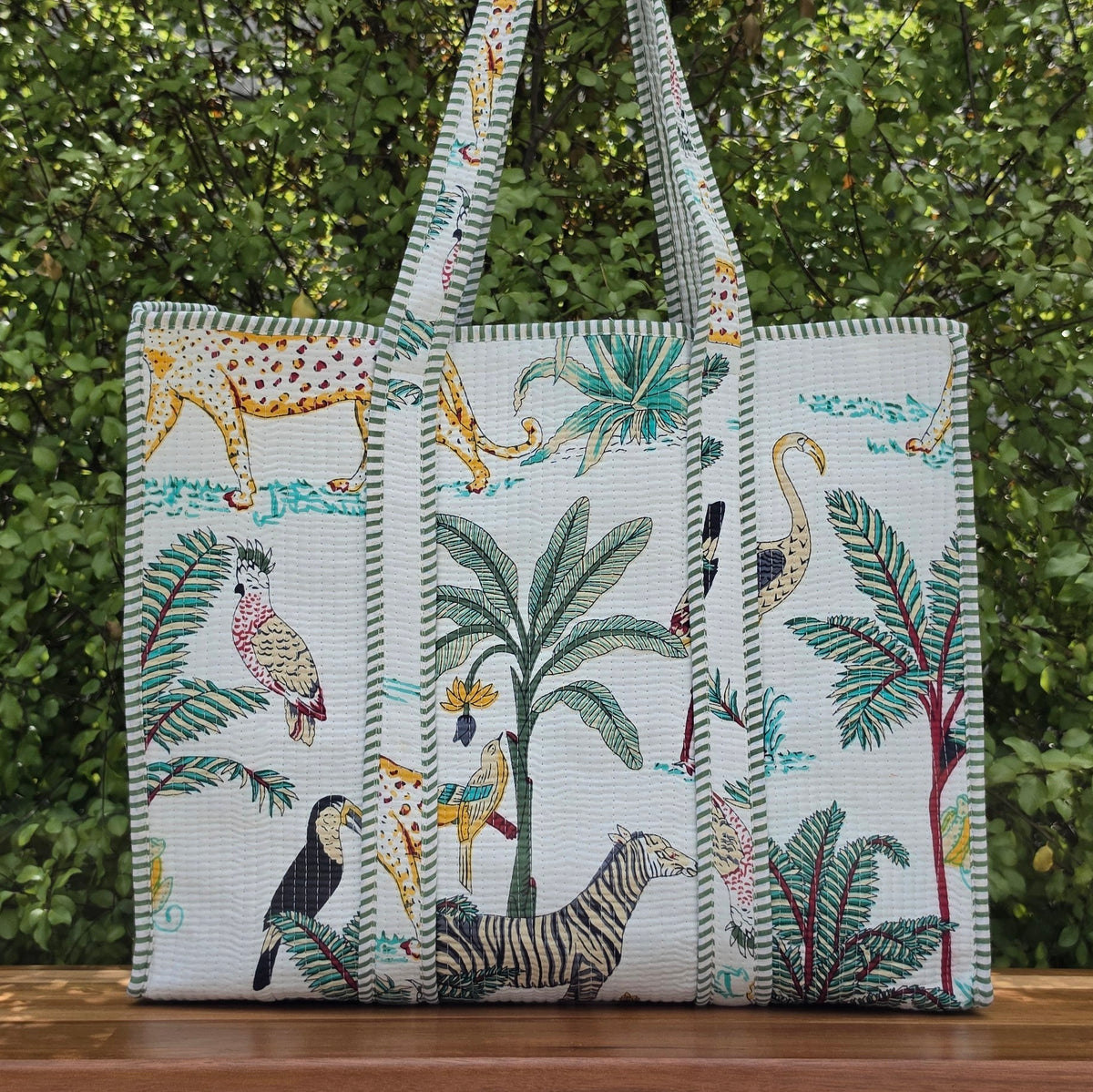 white jungle print quilted cotton tote bag reversible machine washable with pockets lifestyle shot