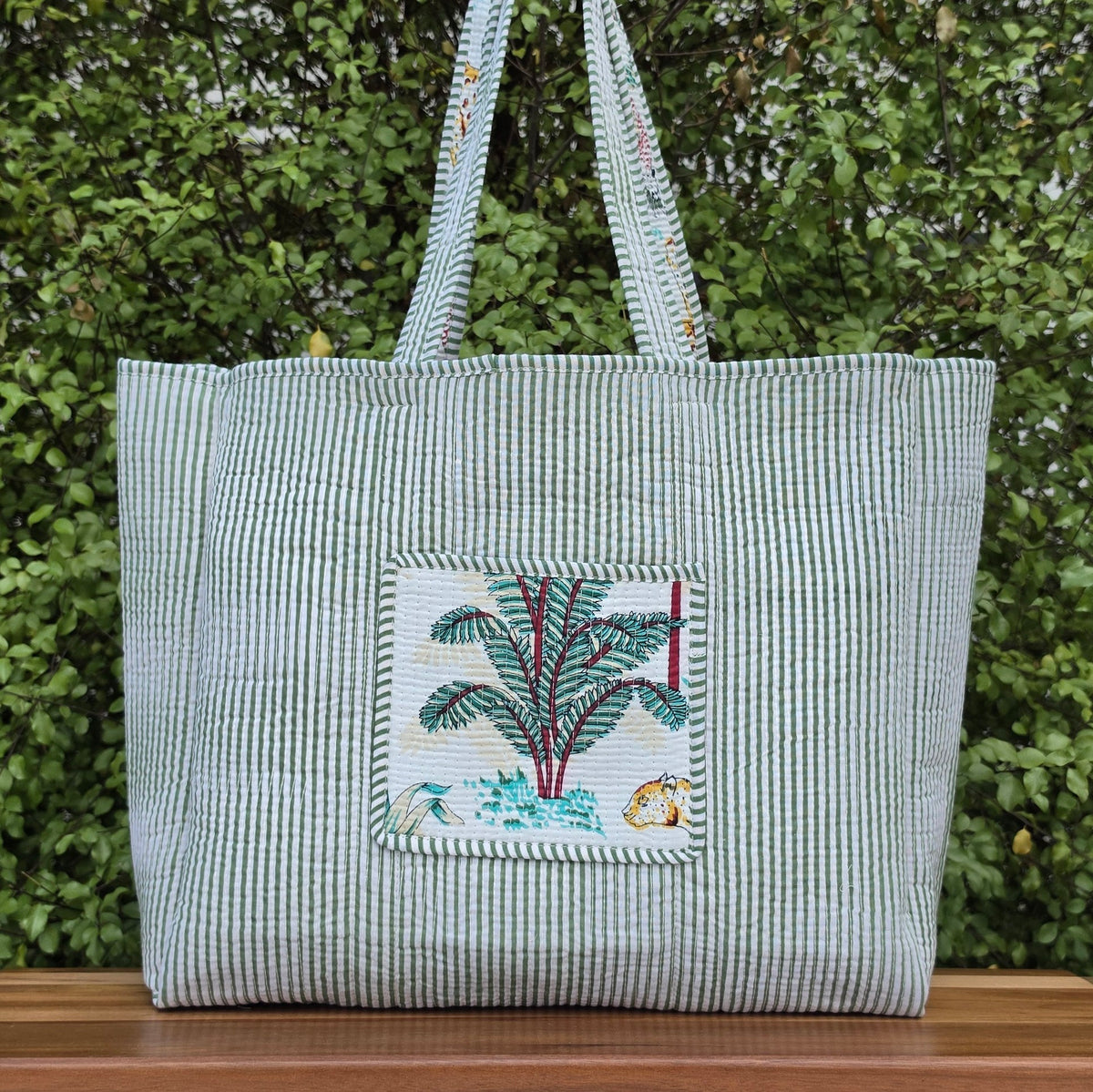 white jungle print quilted cotton tote bag reversible machine washable with pockets reversible lifestyle shot